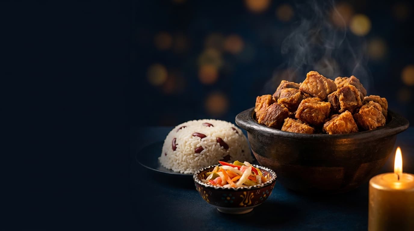 Steaming bowl of Haitian tassot with rice and pikliz
